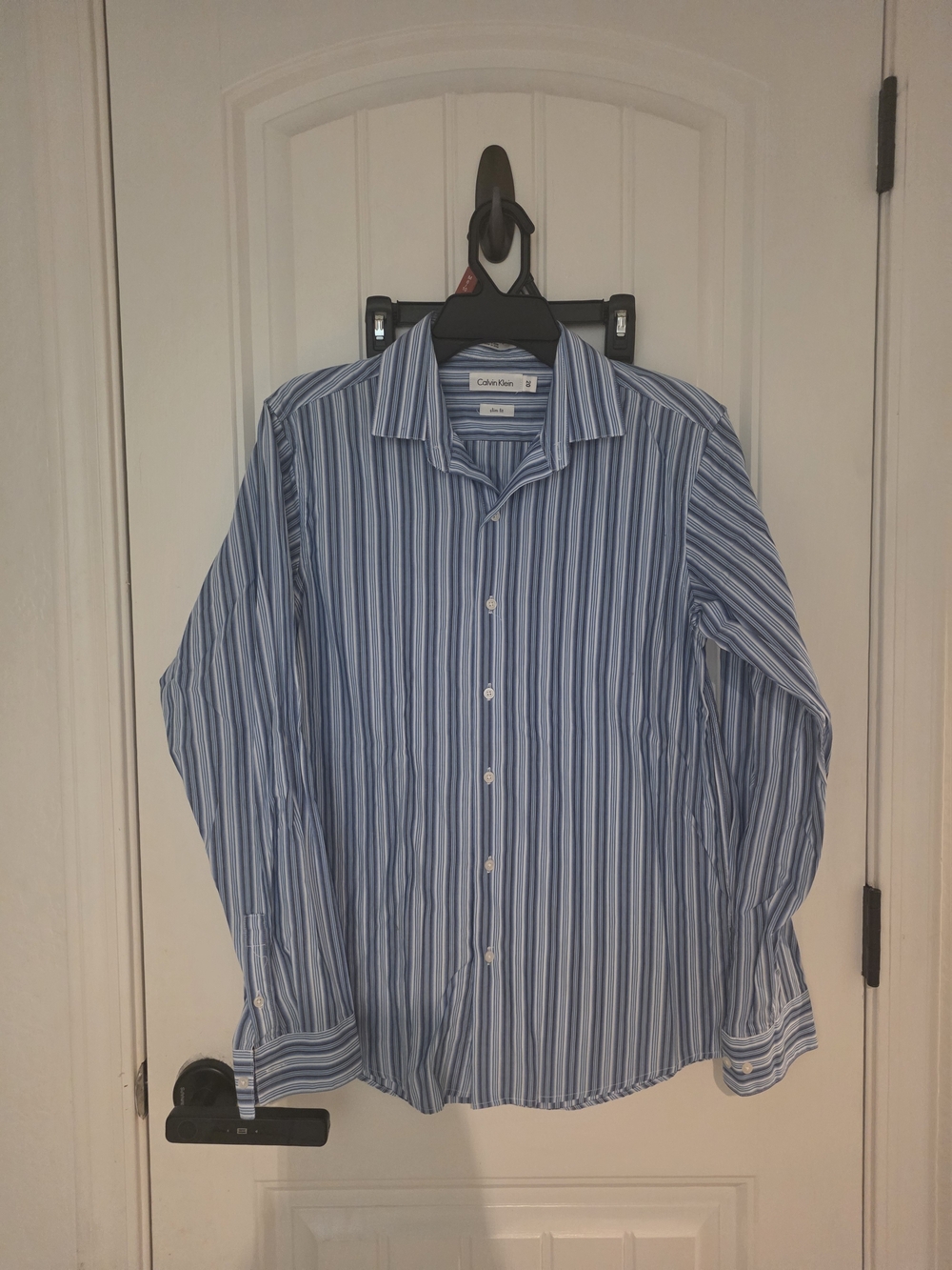 Calvin Klein Men's Blue and White Striped Button-Down Shirt